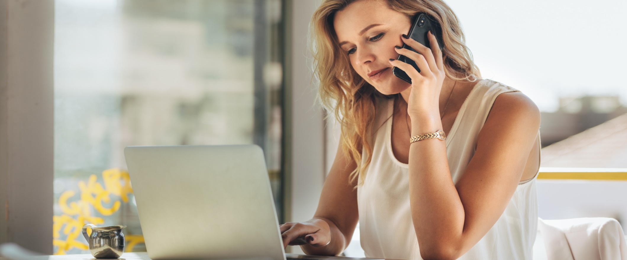 Women on phone and computer 